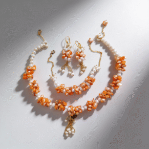 Parure perle dents de mer orange et perle blanche et plaqué or avec motif agate